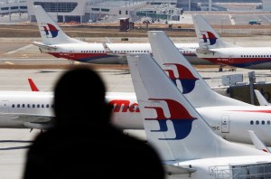 Malaysia Airlines planes sit on the tarmac at the Kuala Lumpur International Airport