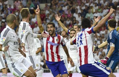 1408489645969_wps_6_Atletico_Madrid_s_midfiel