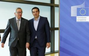 Greek Prime Minister Alexis Tsipras walks with European Commission President Jean-Claude Juncker (L) ahead of a meeting at the EU Commission headquarters in Brussels, Belgium, June 3, 2015.   REUTERS/Francois Lenoir