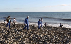 Volunteers of the "3 E" (Eastern Environnement and Economy) association usually in charge of costal cleaning, who found a plane debris and a piece from a luggage on July 29, search for more potential plane debris and items on the shore in Saint-Andre, Reunion Island, on July 31, 2015. Australia on July 31 said it was confident the search for MH370 was being conducted in the right area with aircraft wreckage being washed to La Reunion consistent with the zone they are scouring. AFP PHOTO / IMAZ PRESS REUNION / OUISSEM GOMBRAOuissem Gombra/AFP/Getty Images
