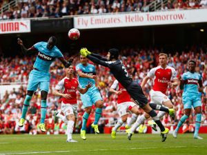 LONDON, ENGLAND - AUGUST 09: Petr Cech of Arsenal fails to punch clear the ball as Cheikhou Kouyate of West Ham United heads in the opening goal during the Barclays Premier League match between Arsenal and West Ham United at the Emirates Stadium on August 9, 2015 in London, England. (Photo by Julian Finney/Getty Images)