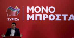 Greek former Prime Minister Alexis Tsipras speaks during a meeting with members of his Syriza party in Athens, August 29, 2015. Tsipras's leftist Syriza party's lead in the polls is narrowing, a survey showed on Saturday, suggesting momentum may be shifting towards the opposition as the country counts down to a snap election. The text reads "Only forward". REUTERS/Stoyan Nenov       TPX IMAGES OF THE DAY