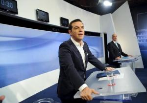 Former Greece's prime minister and leftist Syriza party leader Alexis Tsipras (L) and New Democracy party leader Vangelis Meimarakis stand at their podiums before a televised debate in Athens, Greece, September 14, 2015.  REUTERS/Michalis Karagiannis