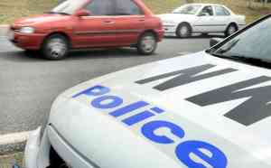 A police car monitors traffic at the launch of the nation wide police campaign RAID in Canberra, Friday, Nov. 21, 2008. RAID (Remove All Impaired Drivers) is aimed at detecting and removing all alcohol and/or drug affected drivers from the nation's roads in the period leading up to the Christmas and New Year holiday period. (AAP Image/Alan Porritt) NO ARCHIVING