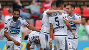 NEWCASTLE, AUSTRALIA - JANUARY 03: Melbourne Victory players celebrate a goal during the round 13 A-League match between the Newcastle Jets and Melbourne Victory at Hunter Stadium on January 3, 2016 in Newcastle, Australia. (Photo by Tony Feder/Getty Images)